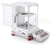 Ohaus - EX225D/AD - With doors open, weight on platform and tweezers on the shelf