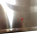 Arrow pointing to a small scratch on the weighing platform